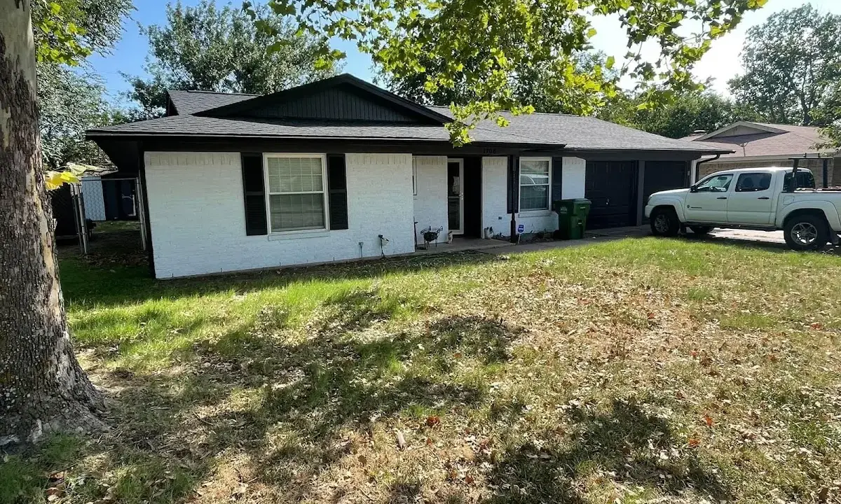 Professional roofing crew working on a residential roof in Rupert